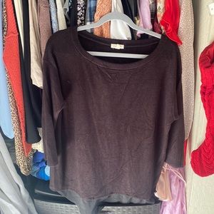 Black soft sweater with ruffle at bottom